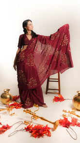 Kanak – Hand-Painted Mehroon Crepe Saree with Metallic Gold Artwork